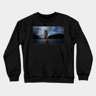 Holding Up a Feather at the Lake Crewneck Sweatshirt